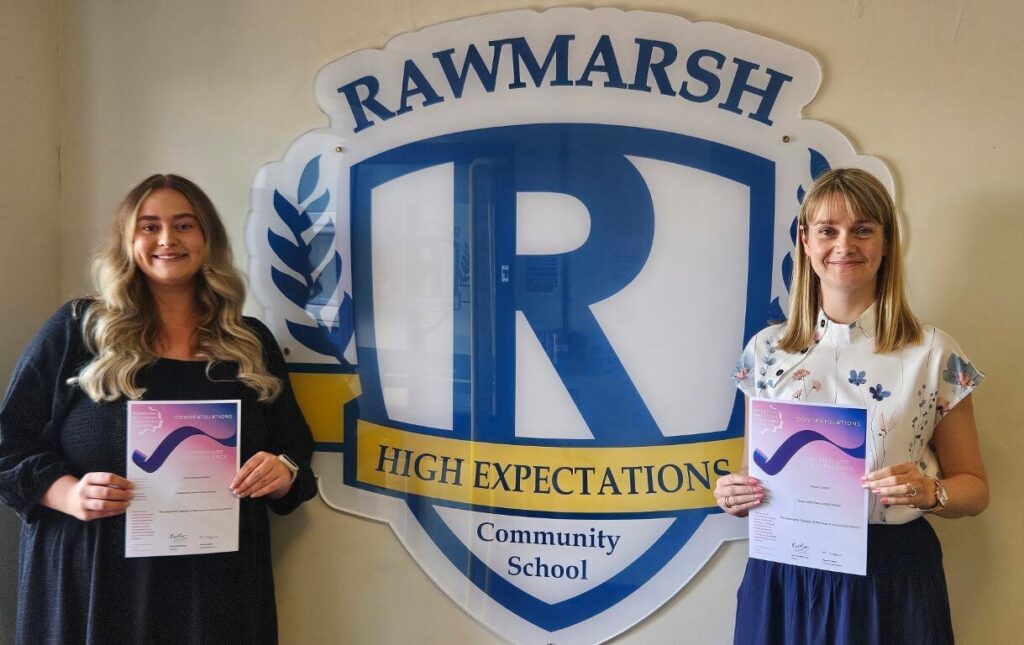 RCS teachers receiving their Certificate of Excellence